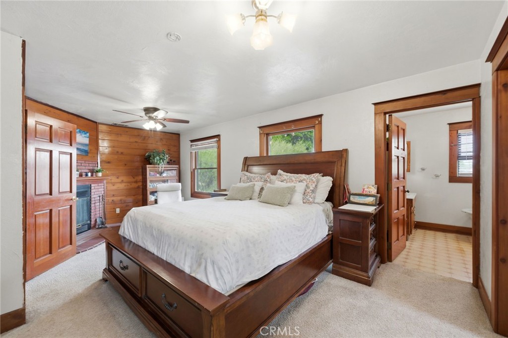 4456 12th Street Riverside, CA 92501 - Photo 30 of 70 a bedroom with a large bed and a chandelier