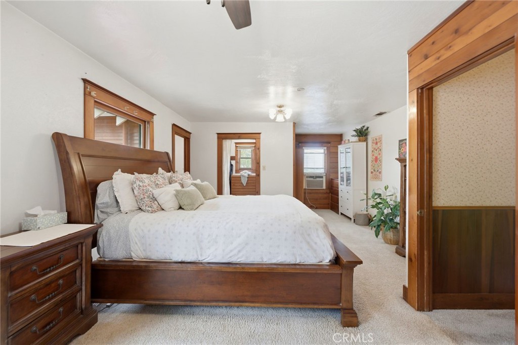 4456 12th Street Riverside, CA 92501 - Photo 31 of 70 a spacious bedroom with a bed dresser and a large mirror