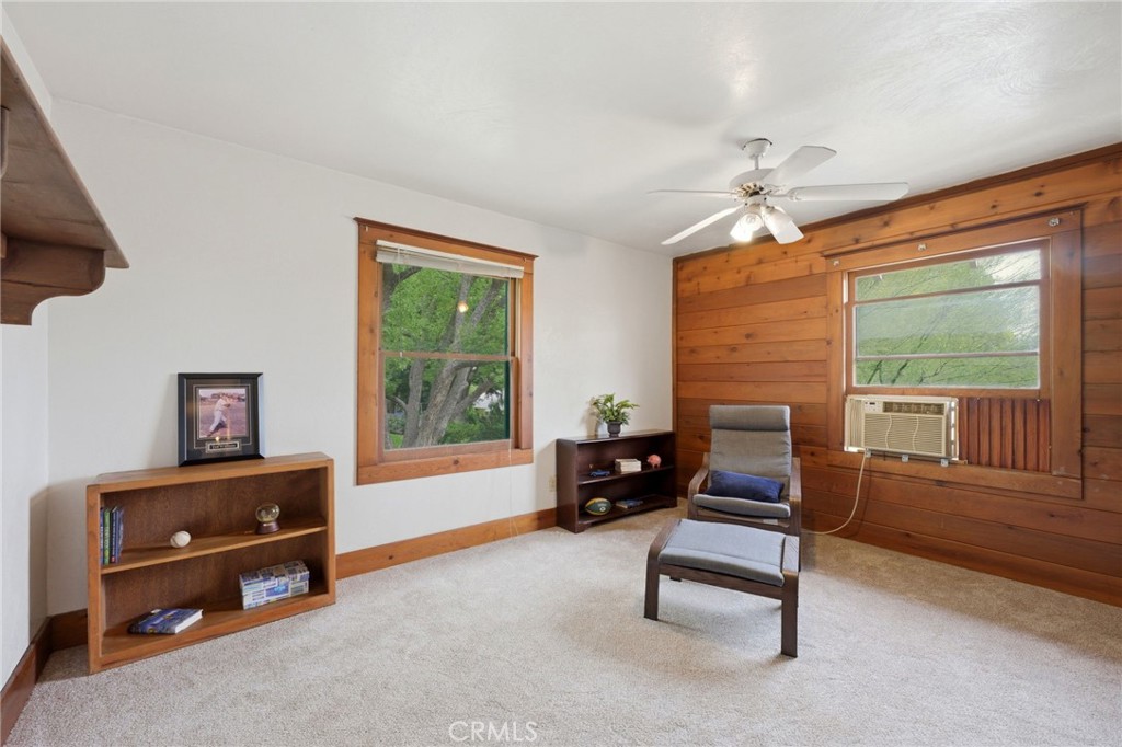 4456 12th Street Riverside, CA 92501 - Photo 42 of 70 a living room with furniture and a floor to ceiling window