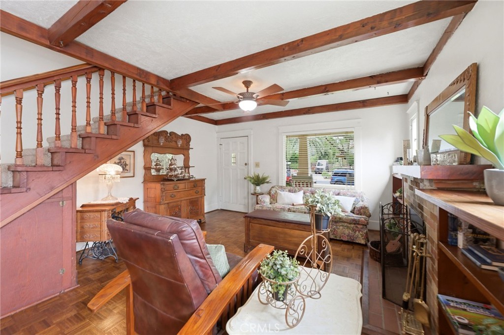 4456 12th Street Riverside, CA 92501 - Photo 5 of 70 a living room with furniture a fireplace and a large window