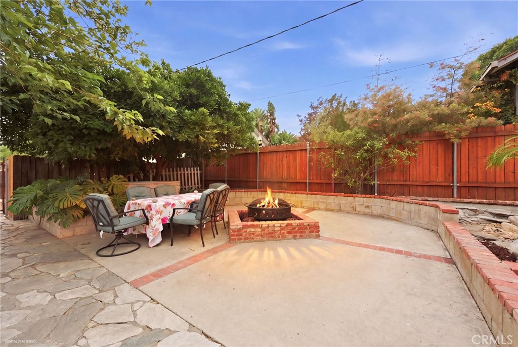 4456 12th Street Riverside, CA 92501 - Photo 53 of 70 a view of backyard with swimming pool and furniture