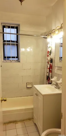 a bathroom with a sink a vanity and a shower