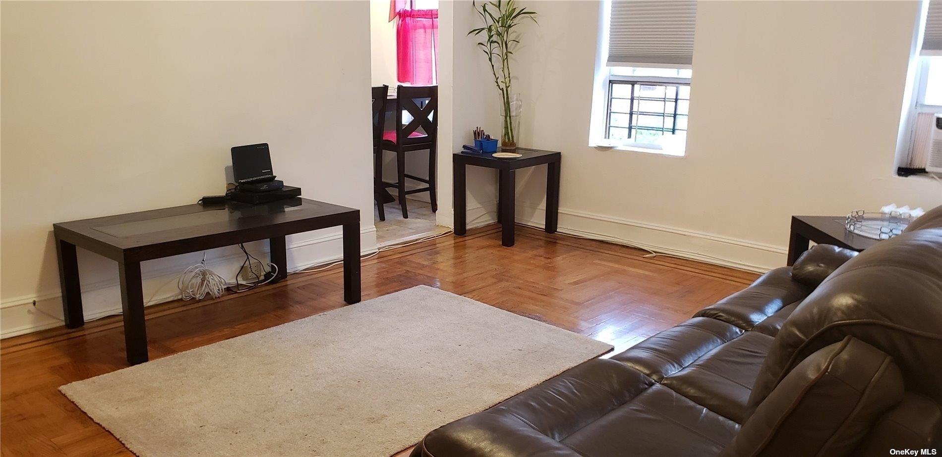 44-15 43rd Avenue, Unit 5N Queens, NY 11104 - Photo 3 of 11 a living room with furniture