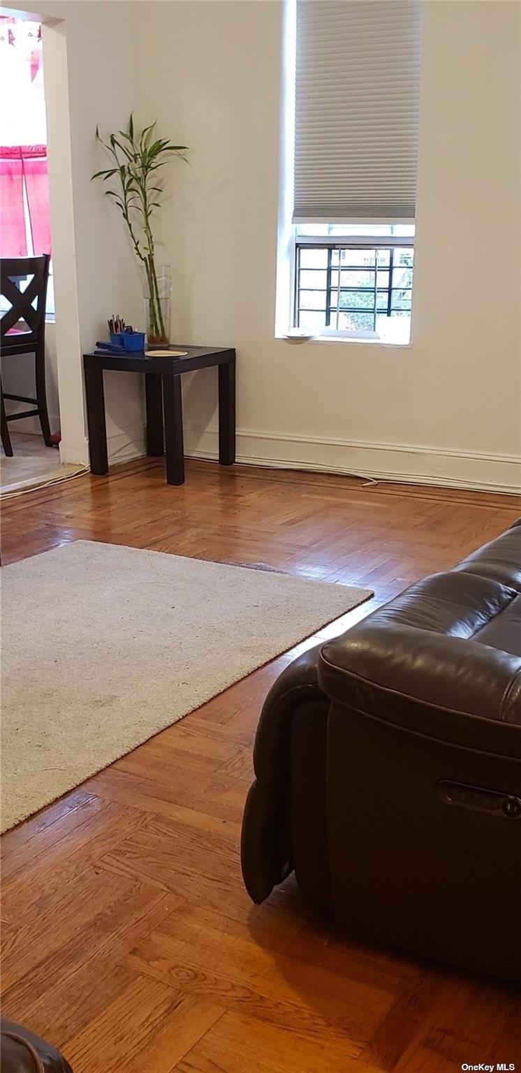 44-15 43rd Avenue, Unit 5N Queens, NY 11104 - Photo 6 of 11 a bedroom with a bed and a window