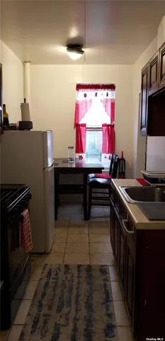 a kitchen with a stove and a sink