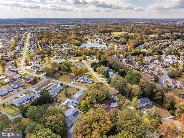 an aerial view of residential building with green space