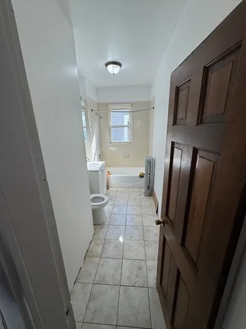 a bathroom with a sink a toilet and a shower