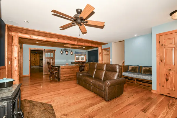 a view of a dining room with furniture and a kitchen