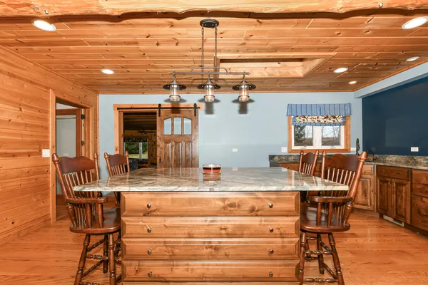 a view of a dining hall with a table and chairs