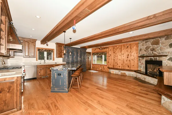 a table with chairs and a stove top oven