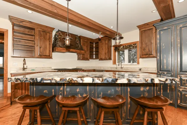 a room with water heater and a wooden floors