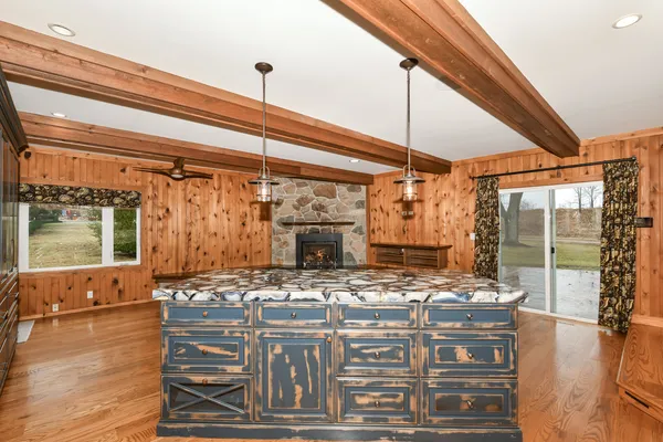 a kitchen that has a lot of cabinets in it