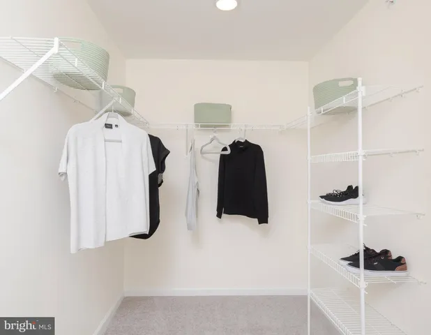 a bedroom with a bed and a wall painting