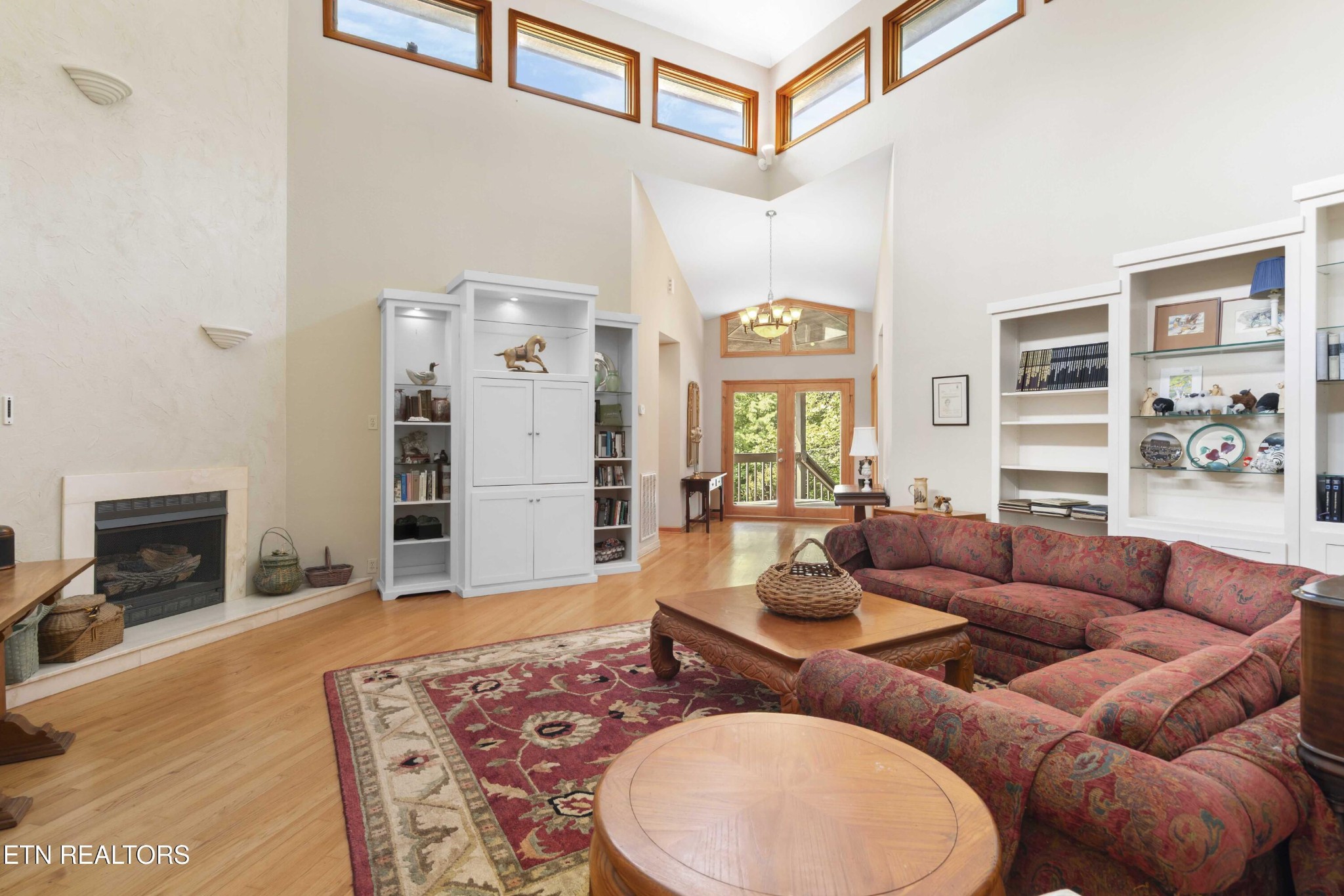 780 Old Emory Road Clinton, TN 37716 - Photo 12 of 33 a living room with furniture a fireplace and wooden floor