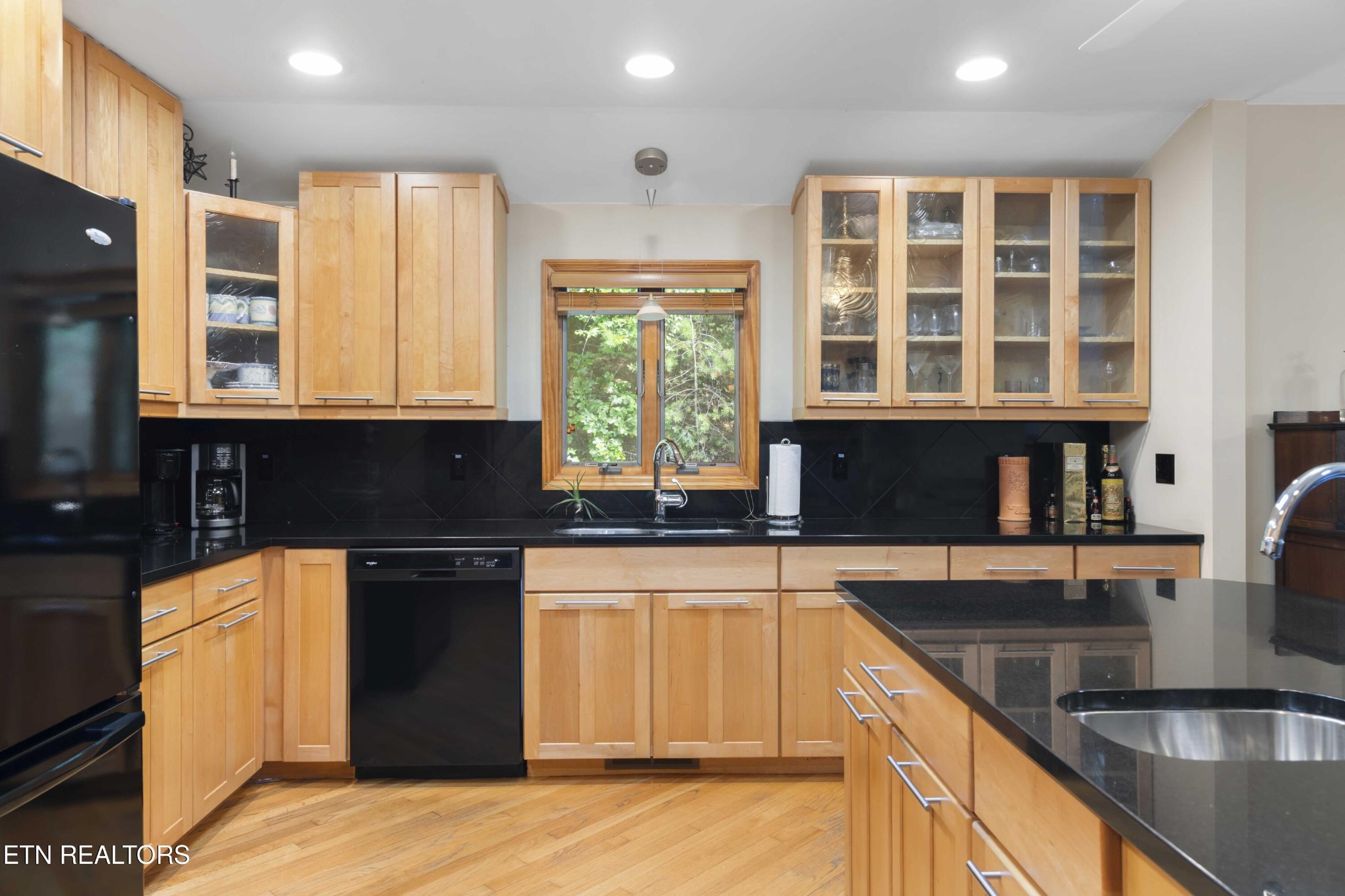 780 Old Emory Road Clinton, TN 37716 - Photo 16 of 33 a kitchen with granite countertop a stove a sink and a microwave