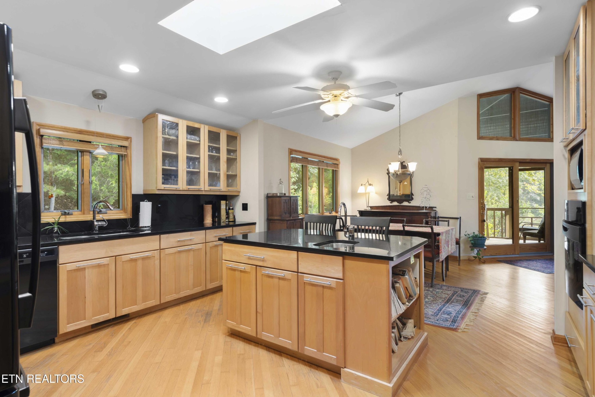 780 Old Emory Road Clinton, TN 37716 - Photo 17 of 33 a kitchen with stainless steel appliances a sink stove and cabinets