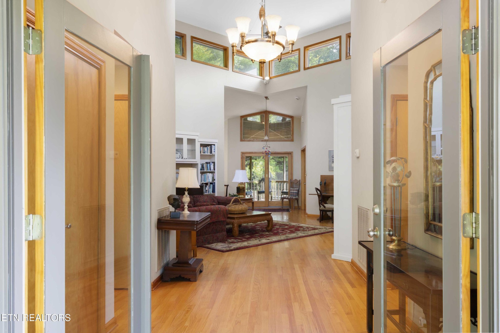 780 Old Emory Road Clinton, TN 37716 - Photo 22 of 33 a living room with furniture and a chandelier
