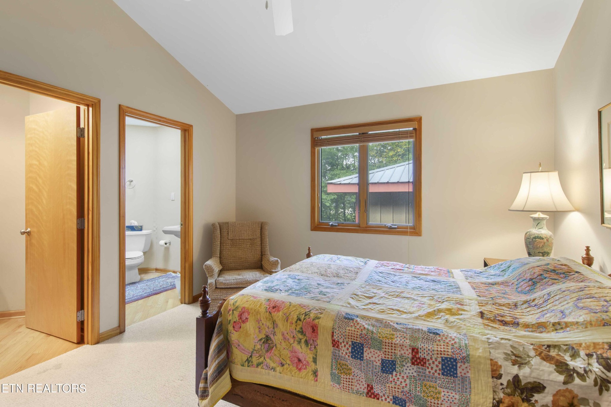 780 Old Emory Road Clinton, TN 37716 - Photo 24 of 33 a bedroom with a bed and a lamp