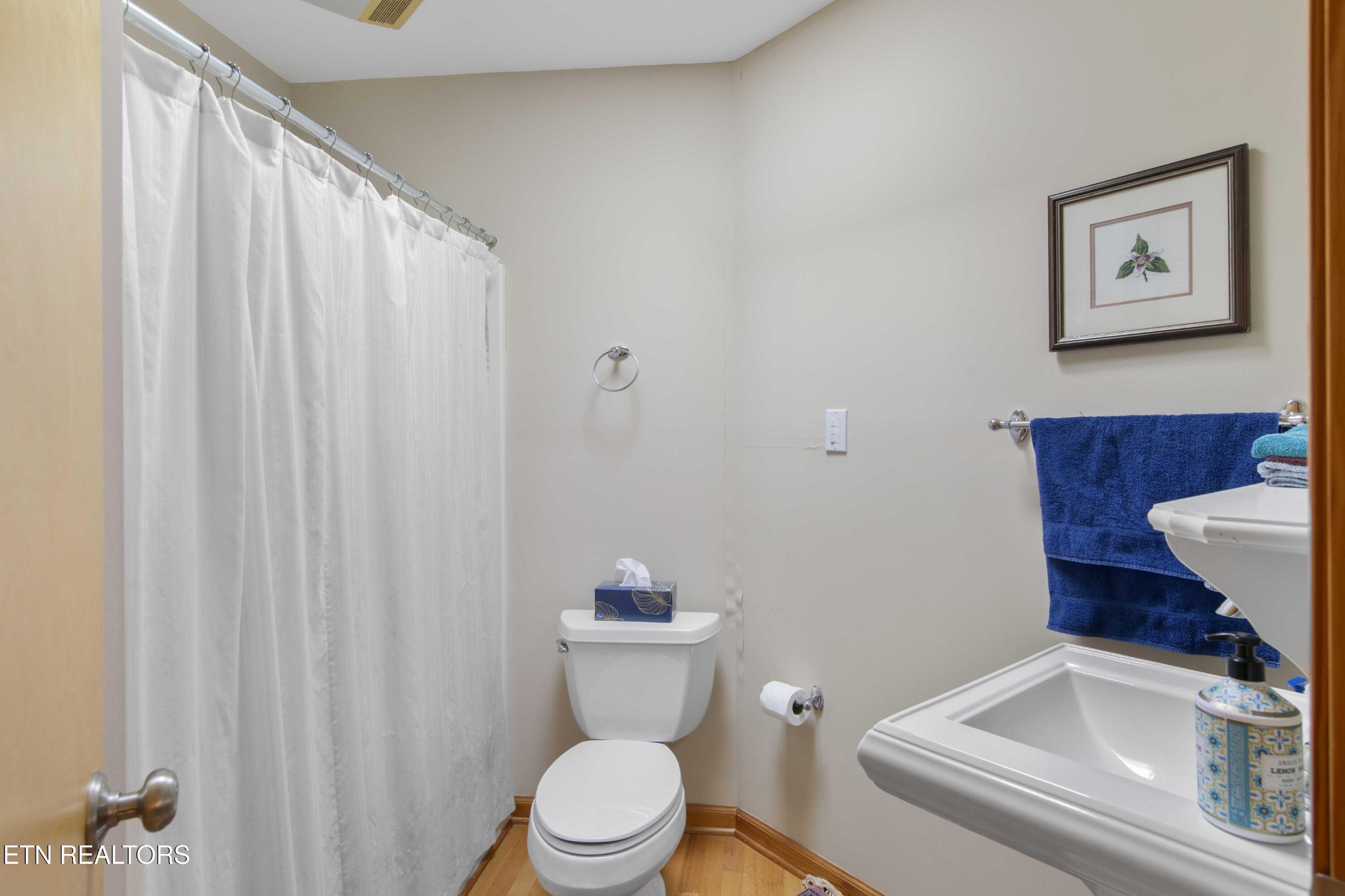 780 Old Emory Road Clinton, TN 37716 - Photo 25 of 33 a white toilet sitting next to a bathroom sink