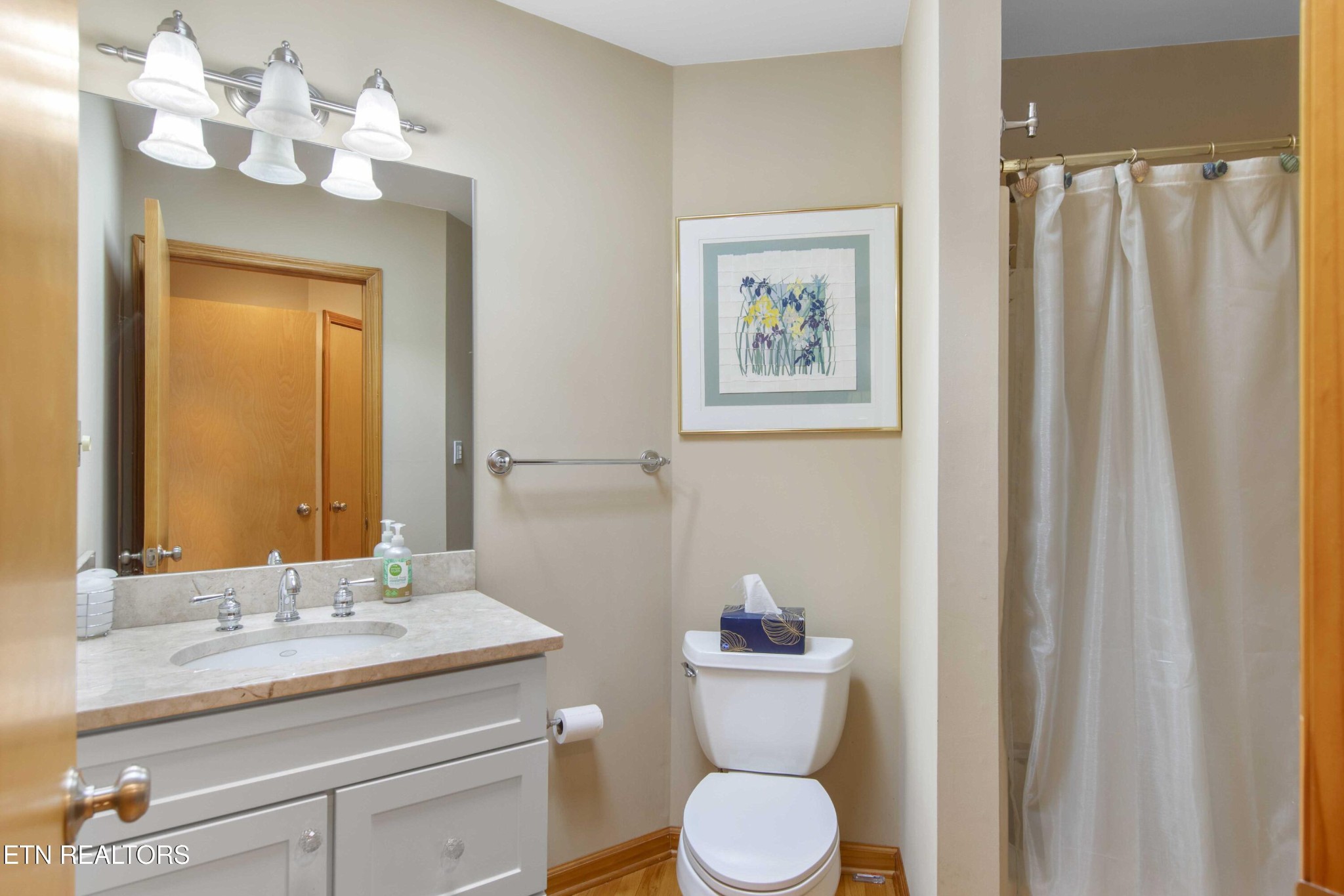 780 Old Emory Road Clinton, TN 37716 - Photo 28 of 33 a bathroom with a toilet a sink and a mirror