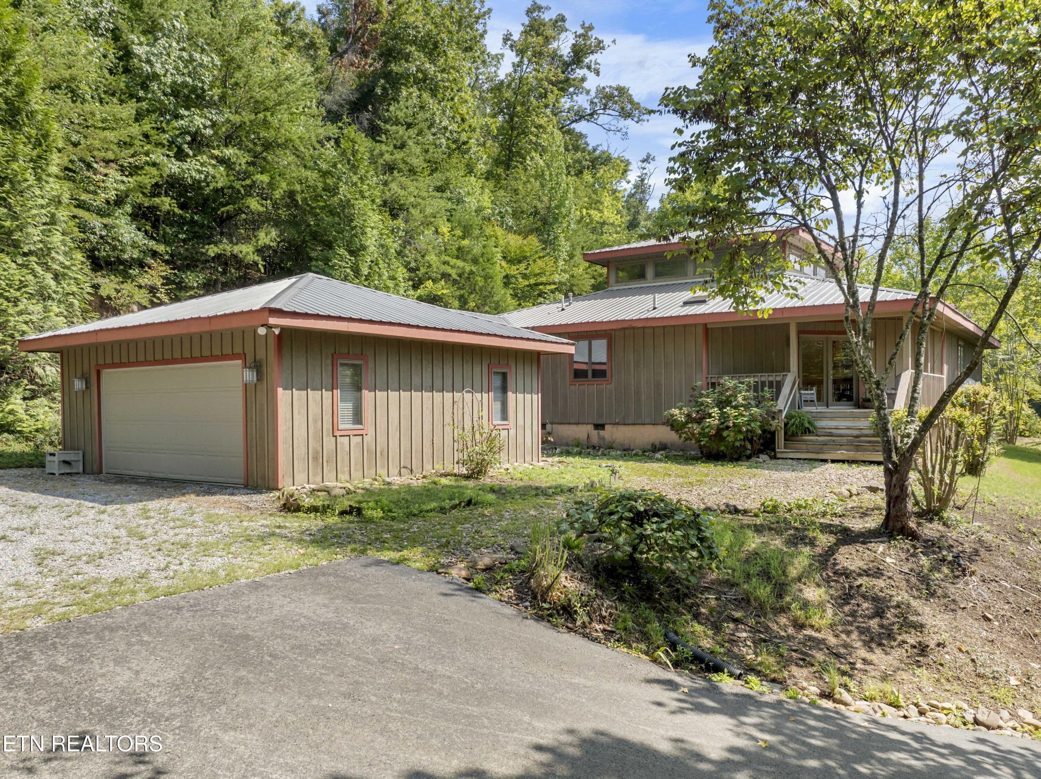 780 Old Emory Road Clinton, TN 37716 - Photo 3 of 33 a house with trees in front of it