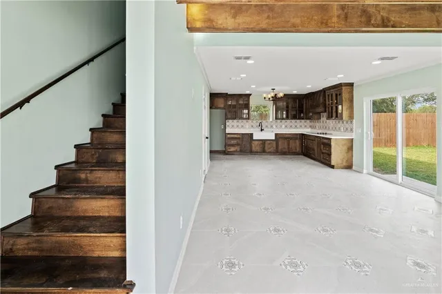 a view of entryway and kitchen