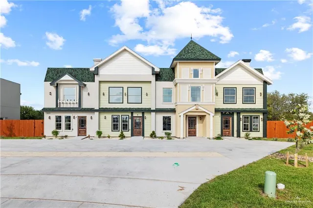 a kitchen with stainless steel appliances granite countertop a sink and dishwasher a stove with wooden cabinets