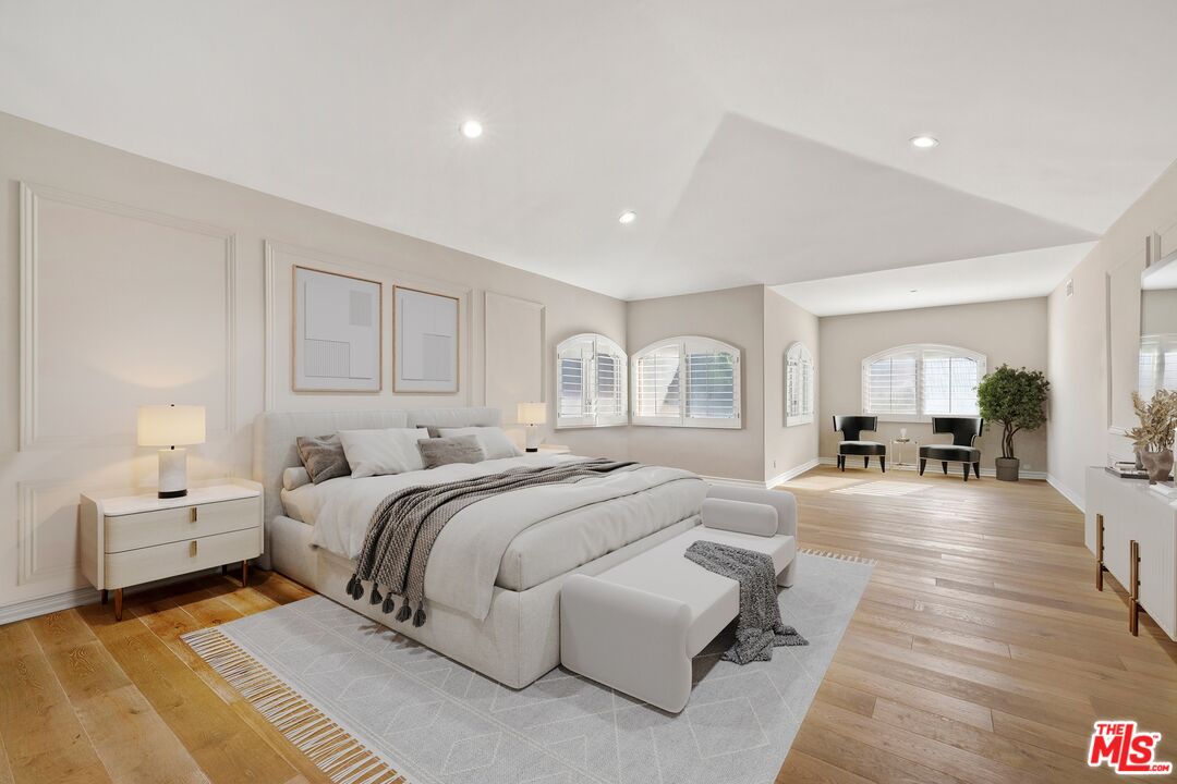 25217 Eldorado Meadow Road Hidden Hills, CA 91302 - Photo 11 of 28 a spacious bedroom with a bed and a couch