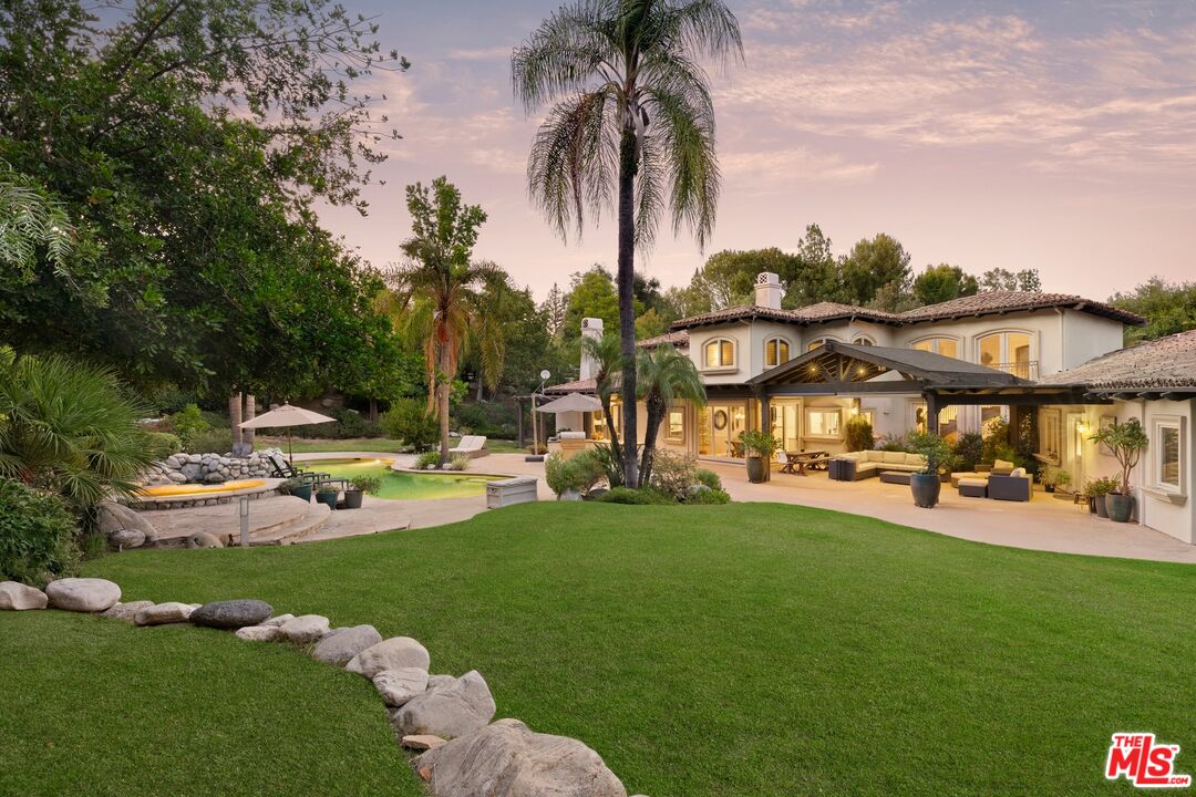 25217 Eldorado Meadow Road Hidden Hills, CA 91302 - Photo 25 of 28 a view of a swimming pool and lounge chairs