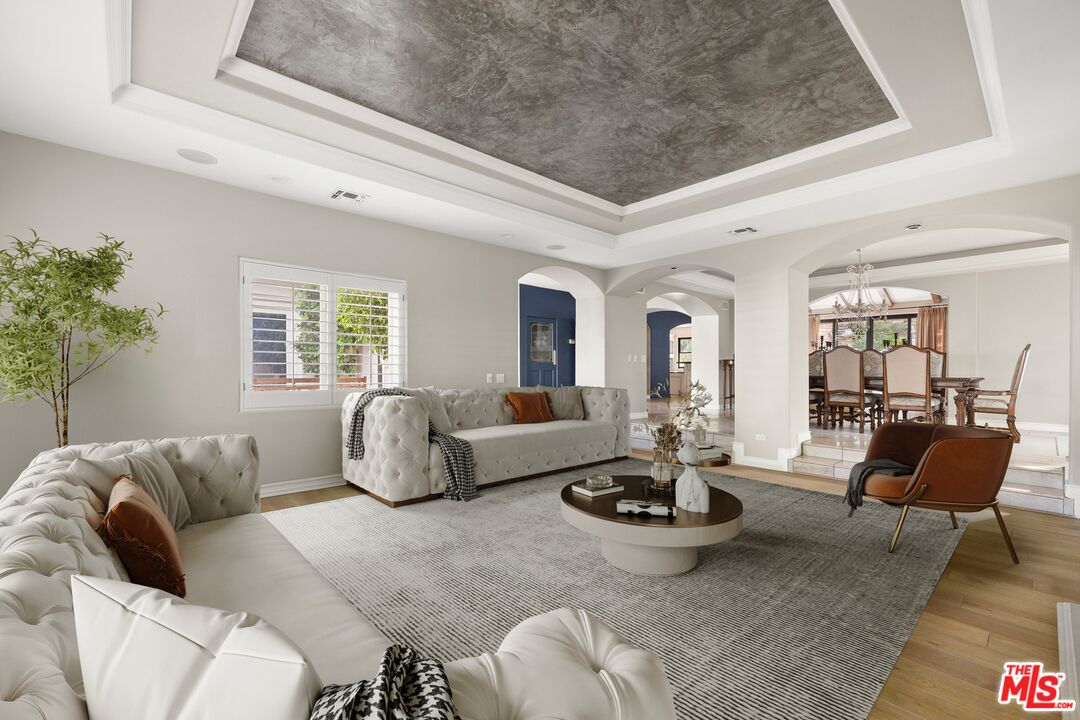 25217 Eldorado Meadow Road Hidden Hills, CA 91302 - Photo 3 of 28 a living room with furniture and a large window