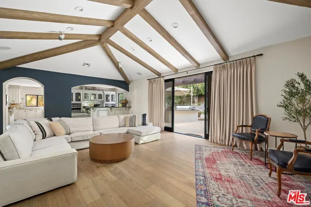 a living room with furniture and a table
