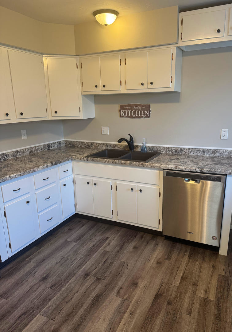 2511 Trafalgar Square Champaign, IL 61821 - Photo 11 of 26 a kitchen with granite countertop a sink a stove and cabinets