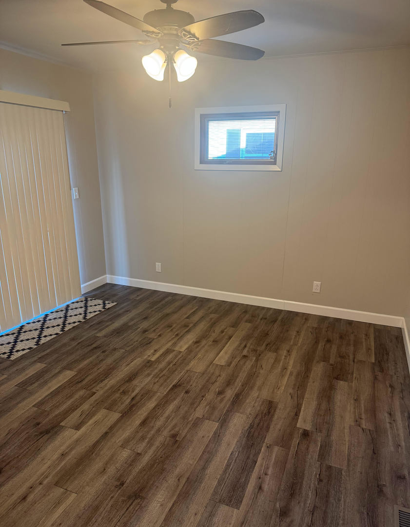 2511 Trafalgar Square Champaign, IL 61821 - Photo 15 of 26 a view of a room with wooden floor and window