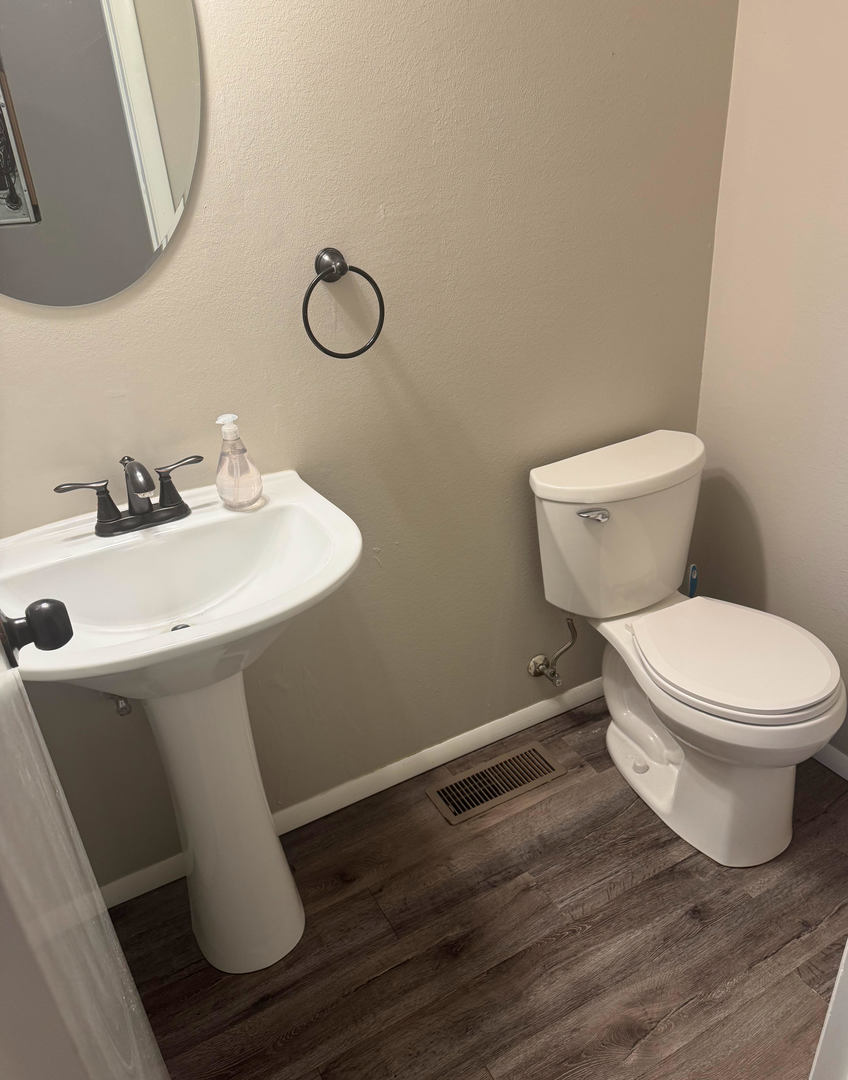 2511 Trafalgar Square Champaign, IL 61821 - Photo 24 of 26 a bathroom with a toilet sink and mirror