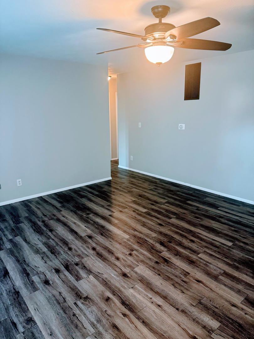 2511 Trafalgar Square Champaign, IL 61821 - Photo 7 of 26 a view of a room with wooden floor and fan
