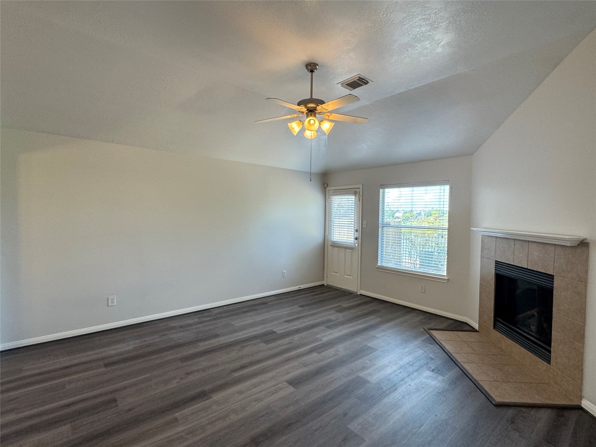 21543 Falvel Misty Drive Spring, TX 77388 - Photo 15 of 40 wooden floor in an empty room with a window