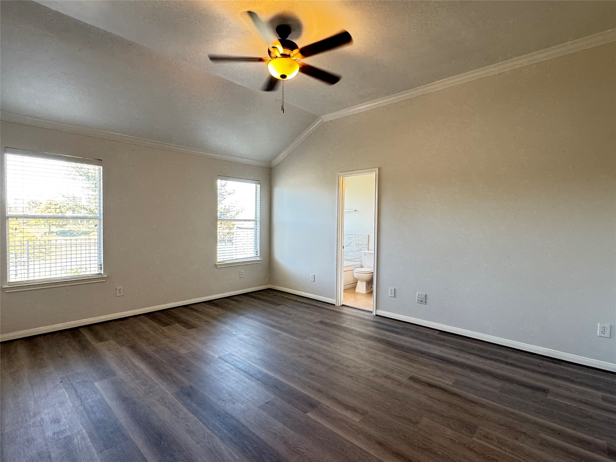 21543 Falvel Misty Drive Spring, TX 77388 - Photo 16 of 40 an empty room with wooden floor fan and windows