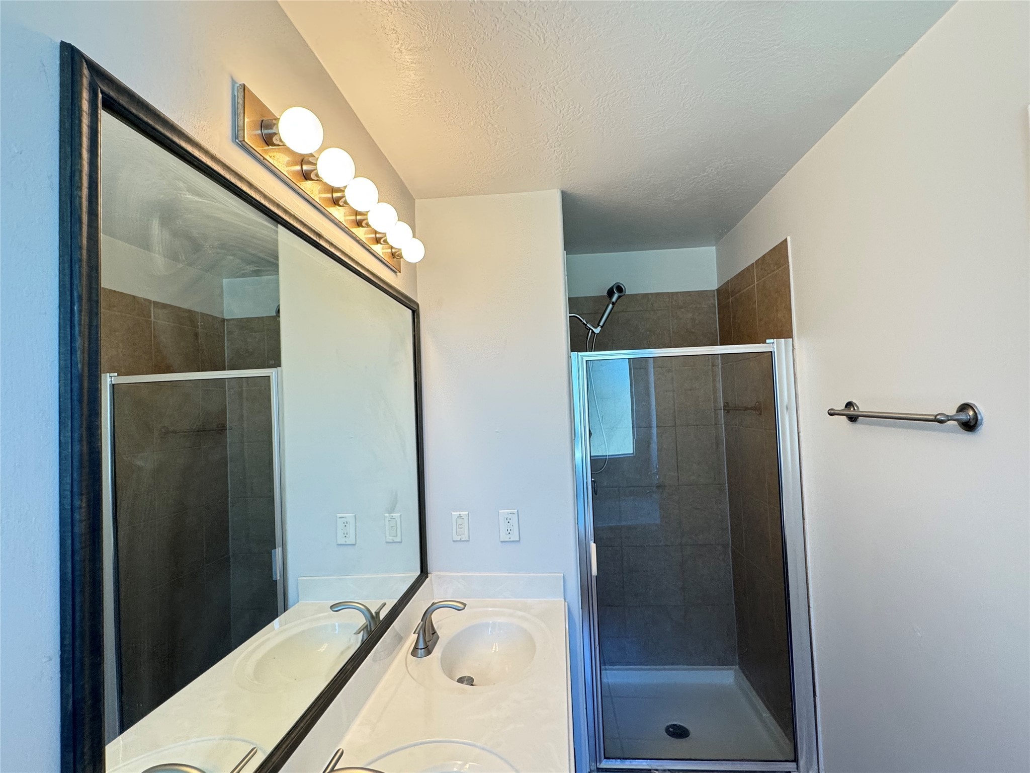 21543 Falvel Misty Drive Spring, TX 77388 - Photo 24 of 40 a bathroom with a bathtub and a shower