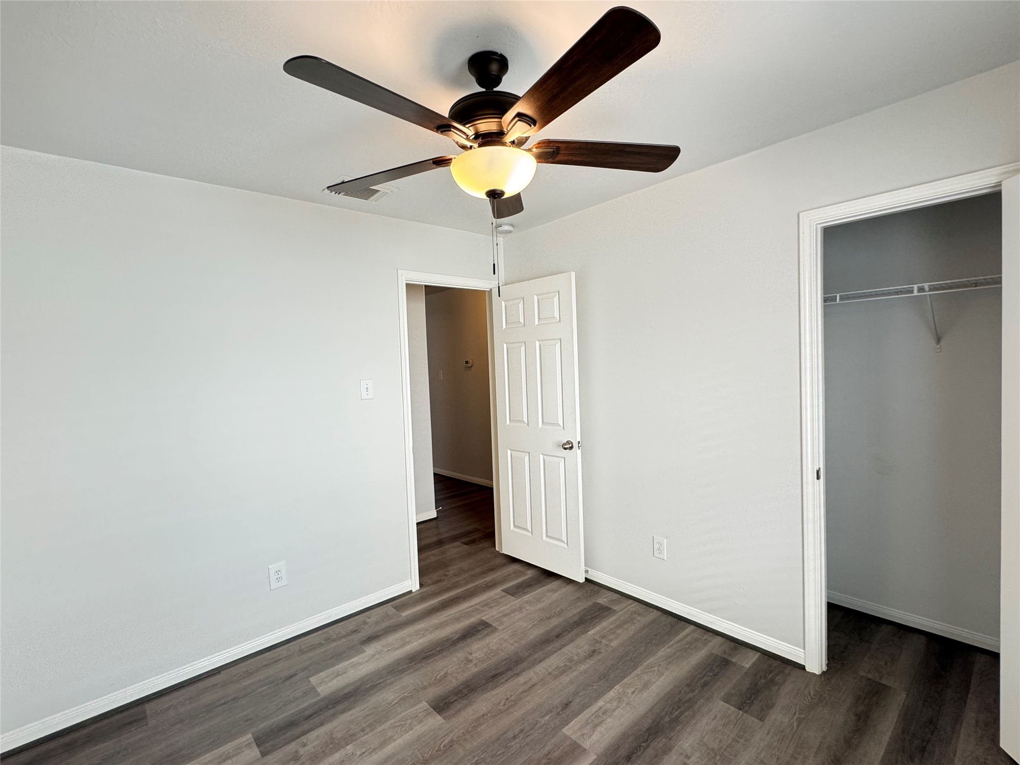 21543 Falvel Misty Drive Spring, TX 77388 - Photo 27 of 40 wooden floor in an empty room with a window