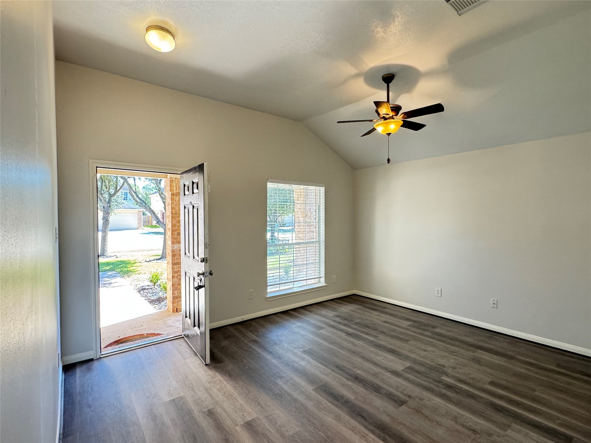 21543 Falvel Misty Drive Spring, TX 77388 - Photo 8 of 40 an empty room with wooden floor and windows