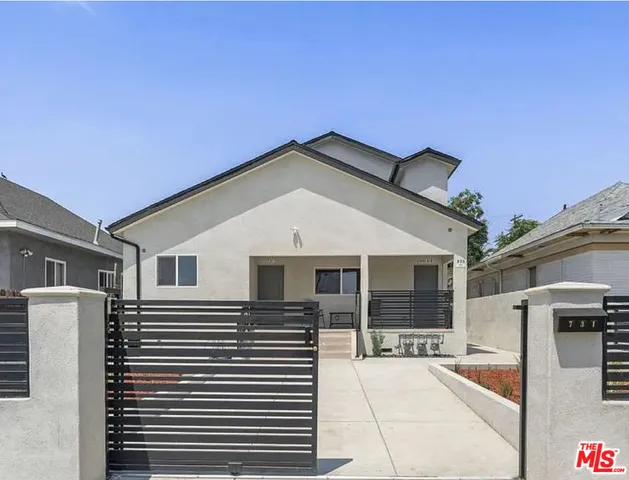 a front view of a house with glass windows