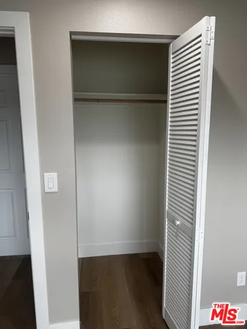 a kitchen with wooden floors and a sink