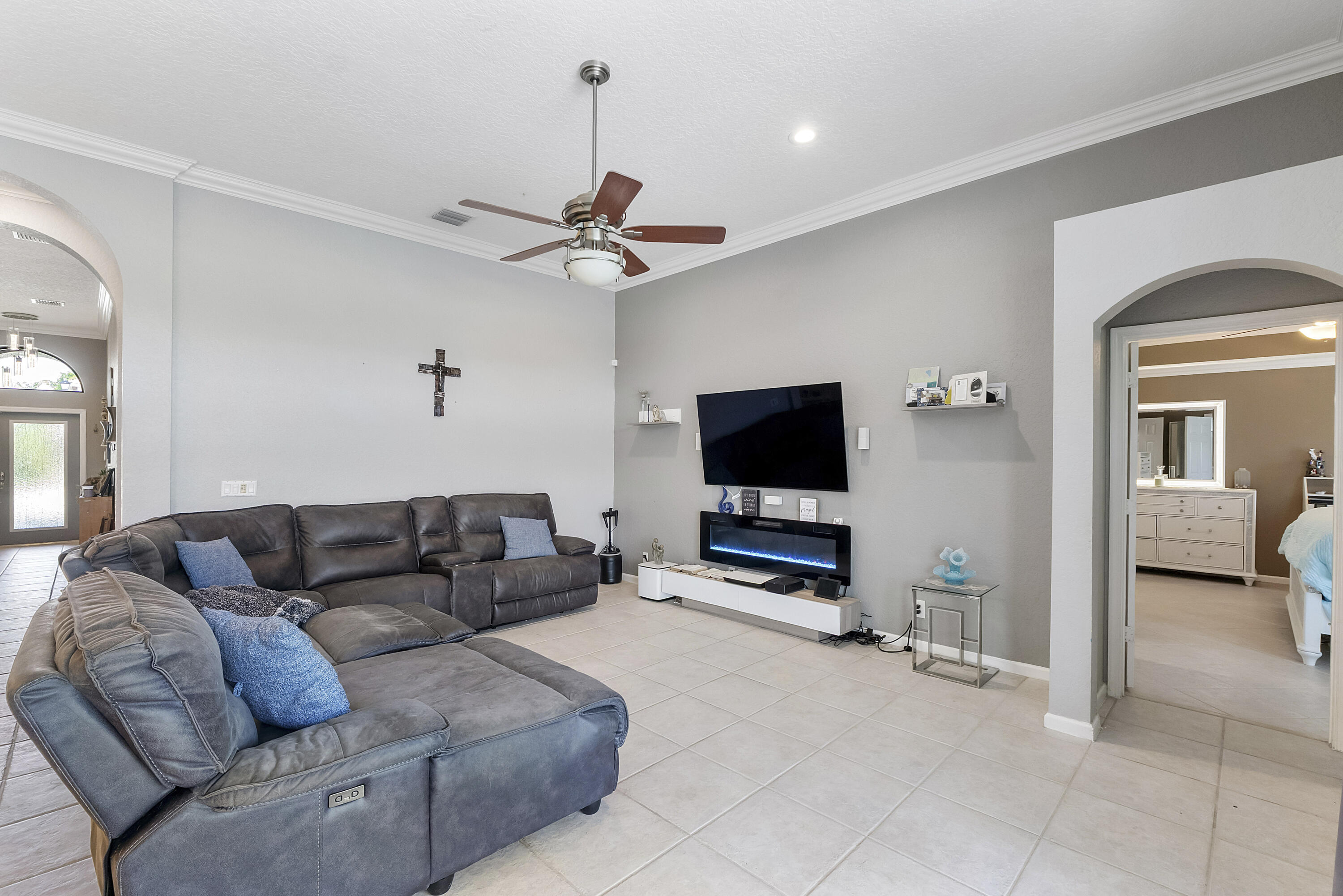 12328 St Simon Drive Boca Raton, FL 33428 - Photo 19 of 52 a living room with furniture and a flat screen tv