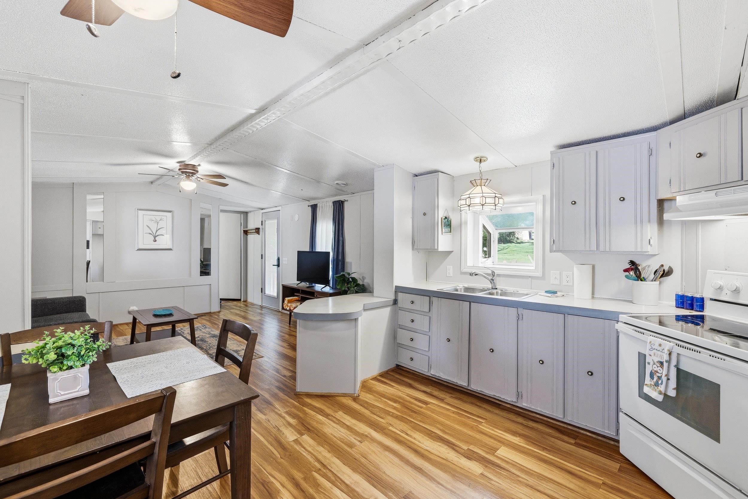702 Richview Road Rileyville, VA 22650 - Photo 6 of 75 a kitchen with sink cabinets and wooden floor