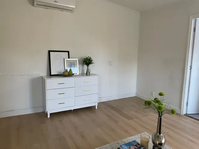 a room with a dresser