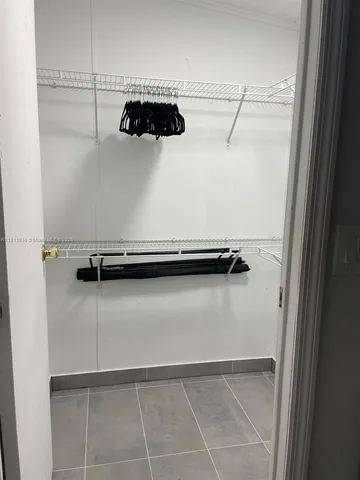 a close view of a faucet a washer and dryer