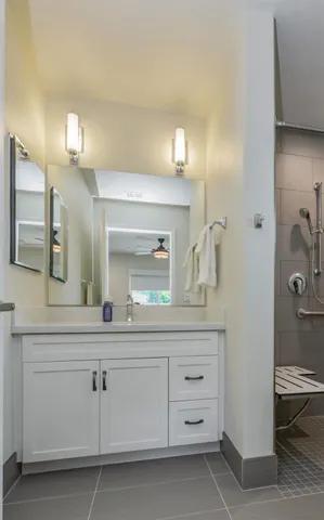 a bathroom with a sink and a mirror