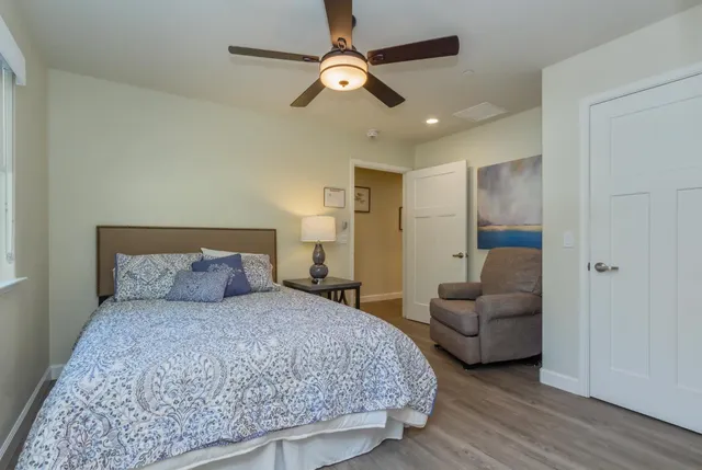 a bedroom with bed and a couch