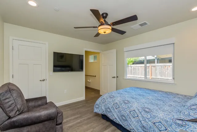 a bathroom with a sink a mirror and a light fixture