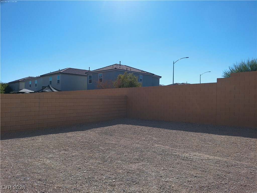 6607 Dove Point Place Las Vegas, NV 89130 - Photo 14 of 14 Fenced backyard featuring a residential view